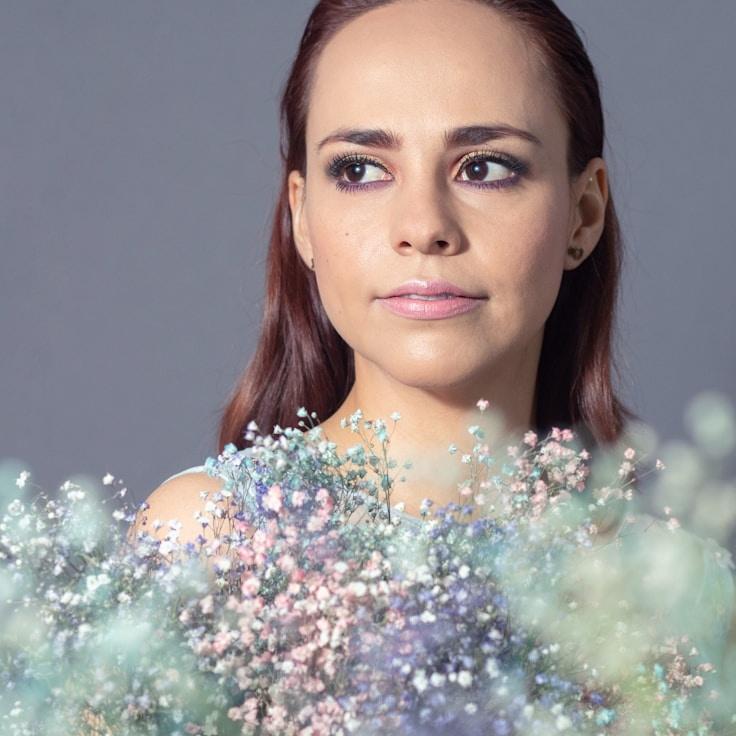 Kaveri Mehta, Lead Design Curator at BlueCoreStudio, reviewing corporate floral arrangements